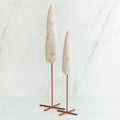 Set of two white tree figurines with wooden stands - all white background